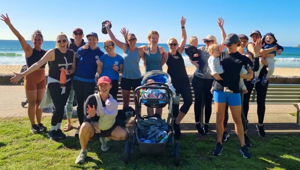women smiling at camera after a workout